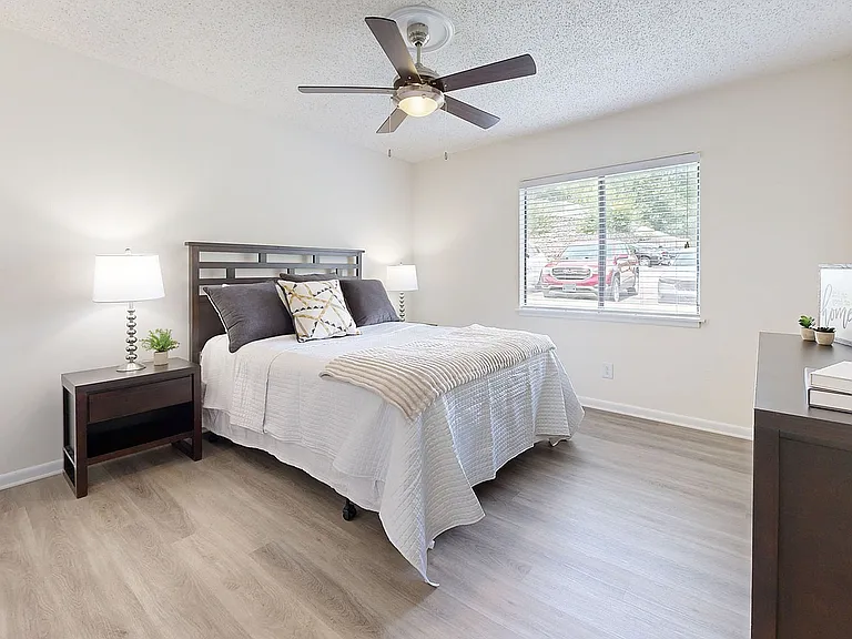 Bedroom with hardwood-style flooring
