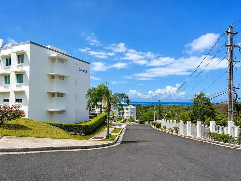 CARACOLES BUILDING Cond Hillside Village #E-201 — Photo 1