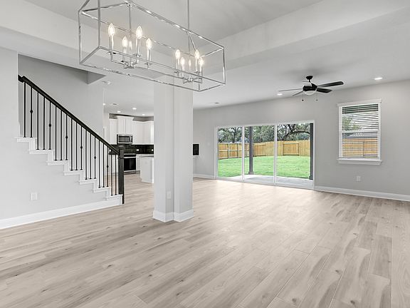 The living room is spacious and has great, natural light.