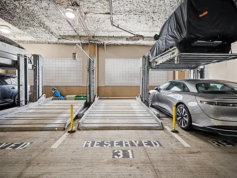 Unit comes with two, covered parking spots in the garage. Easy to pull in and out.