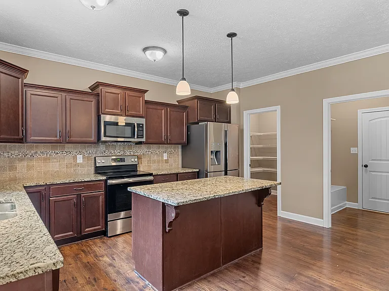 Full walk-in pantry and Mud Room access to garage (additional closet not pictured behind door)