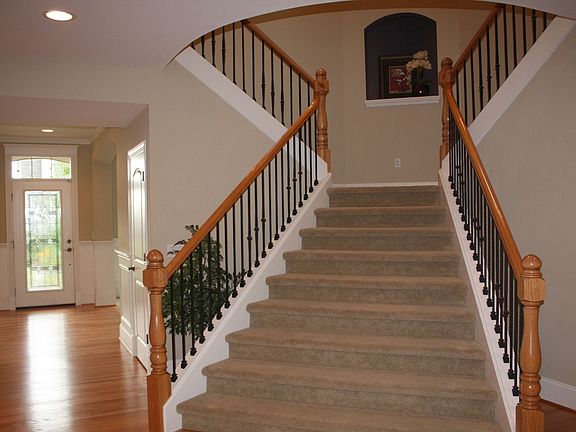 Elegant spindle staircase and railing.