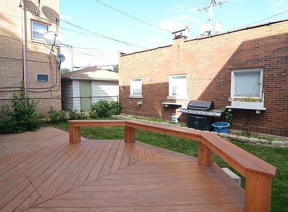 Shared backyard with deck and paver patio