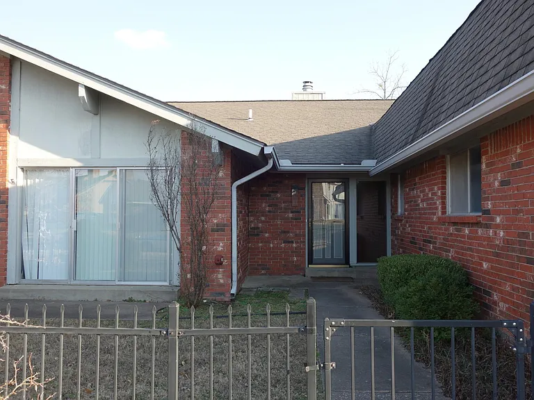 Gated Front courtyard. *The Visible Sliding door will be converted to a window.*