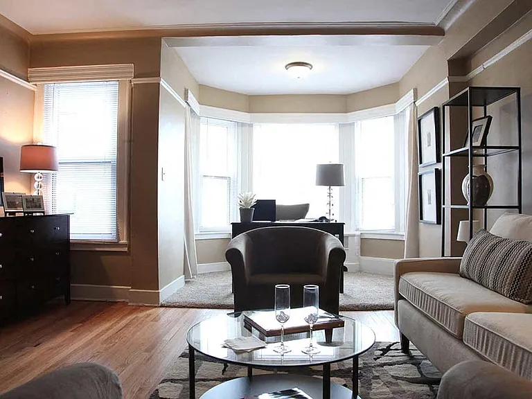 Furnished living room with architectural details.