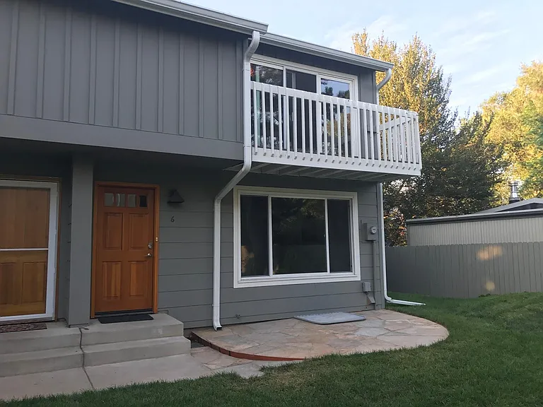Front patio. The side yard leads to the back gate.