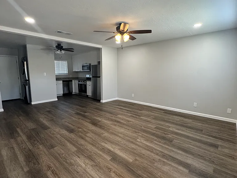 Newly remodeled unit has updated plank flooring throughout. Large, open living room upon entering the unit