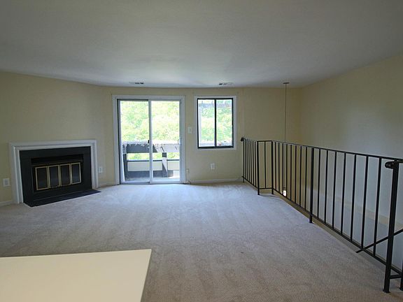 Living Room with fireplace and access to balcony