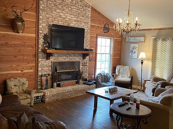 Living room with gas logs in fireplace