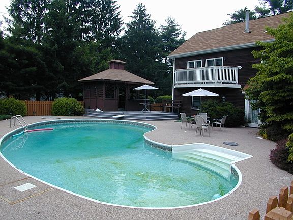 Private fenced in pool with diving board and Jaccuzzi Hot Tub in Private Gazeb
