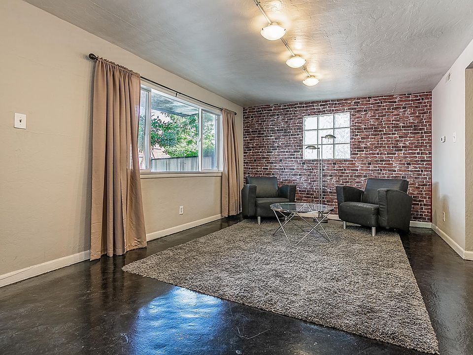 Living room with a BIG windows, bright and sunny.