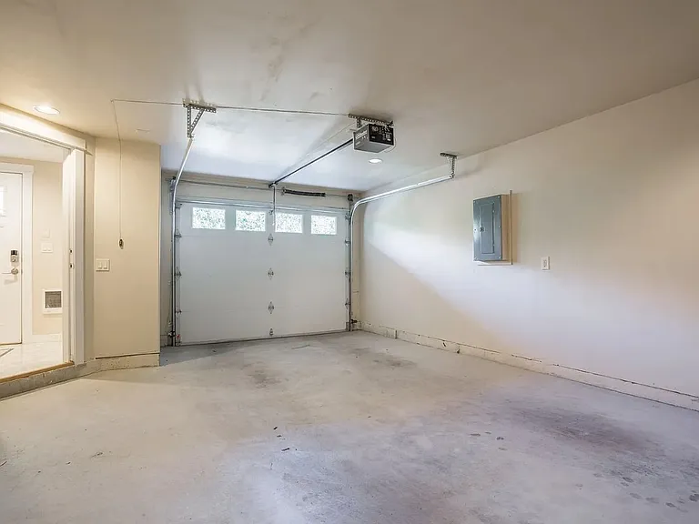 Attached Garage with Level 2 (240v) fast charger for Electric Vehicles.