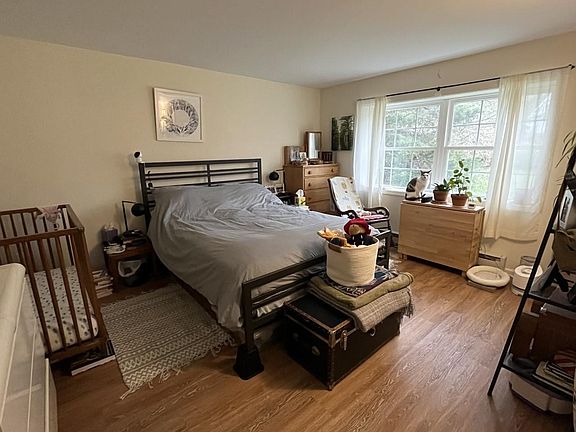 gorgeous private view from large windows in generously sized bedroom with 2 closets