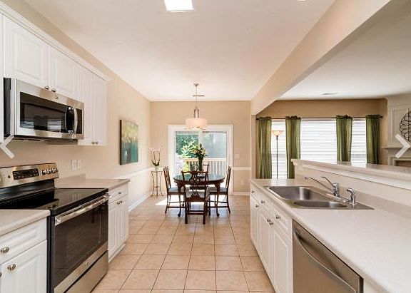 Kitchen and Dinning area with access to private Deck and Entertainment area