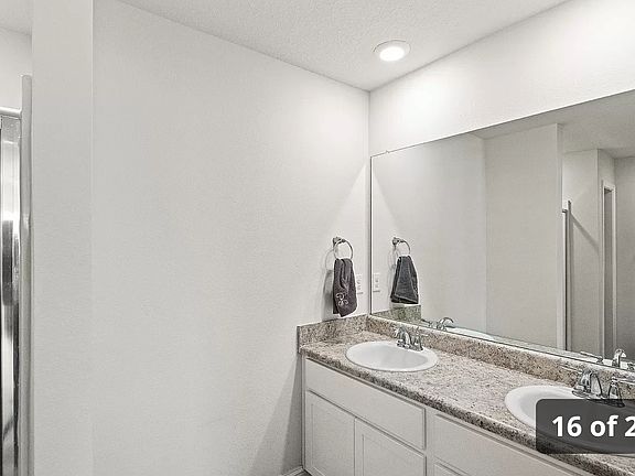 Master bathroom includes twin sinks.