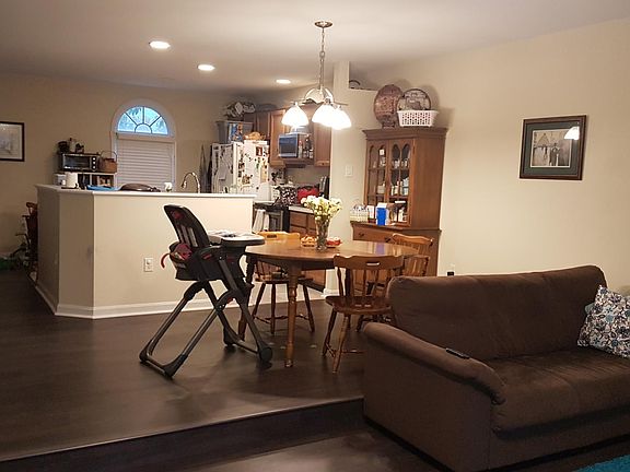 View from Living Room into Kitchen (photo is before cabinet refacing and refrigerator replacement. See previous kitchen picture with updates).