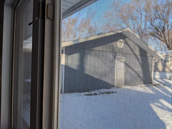 View from kitchen sliding door toward the back of the attached garage