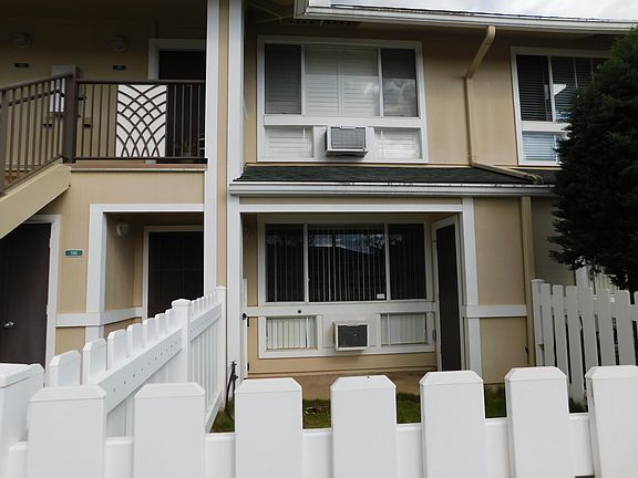 Rarely available ground floor unit with front AND back courtyards.