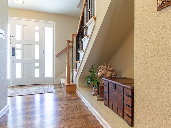 Hardwood floors grace the entry, powder room, kitchen, nook and family room.