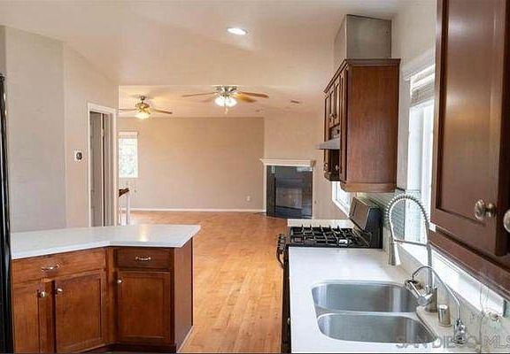 Kitchen into living room. Empty and unpainted.