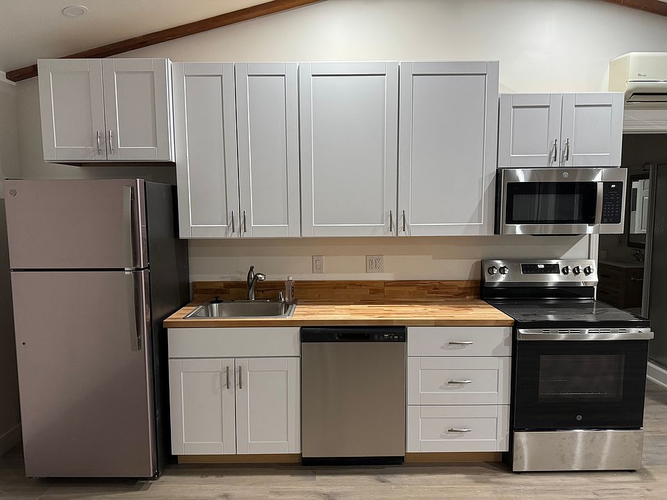 New cabinets/counter/faucet & sink. New Appliances all stainless steel (range/oven, microwave, dishwasher, refrigerator and garbage disposal). New Shaker Cabinets.