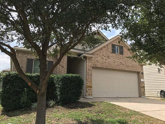 Front of house. Across the street downslope is a very large open green preserve with lawn, pond, trees for a great view.