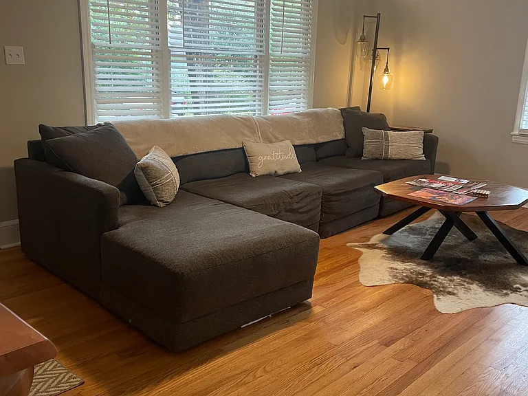 Spacious Living Room with Windows & Blinds