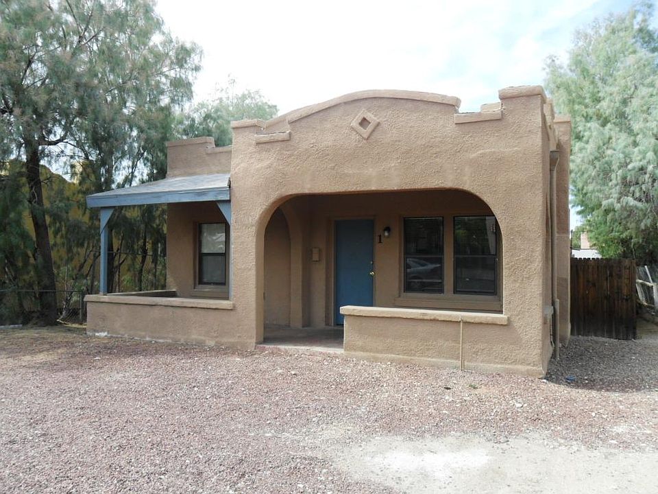Charming home with a large front porch and parking for 5 cars.