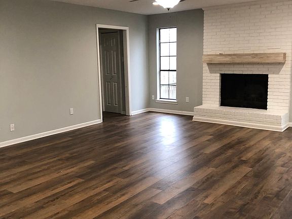 Wood burning fireplace, coat closet off garage