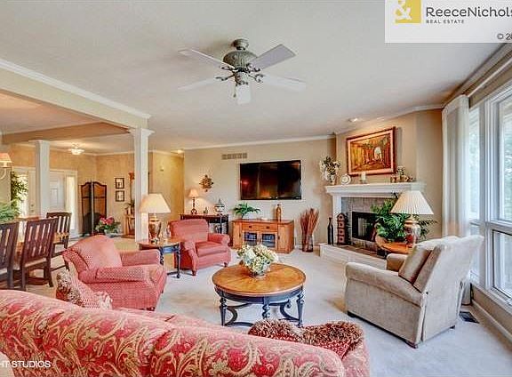 Open floor plan: living room with bank of windows