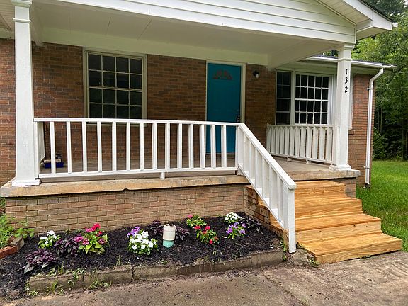 Flowers carefully planted into the beds. Front porch made for rocking chairs and sweet tea!
