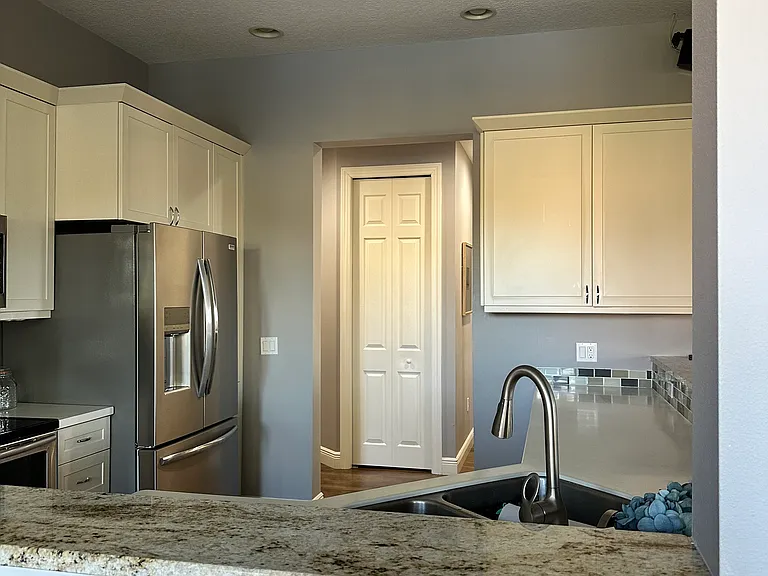 Kitchen has tons of cabinets for storage
