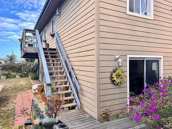 Back entrances to upstairs living and downstairs bedroom/apartment.