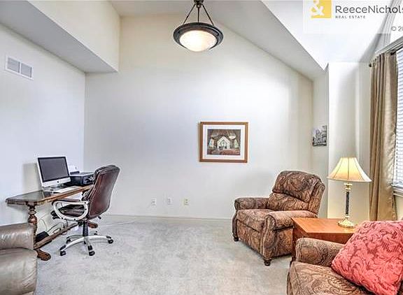 Office/piano room with high ceilings.