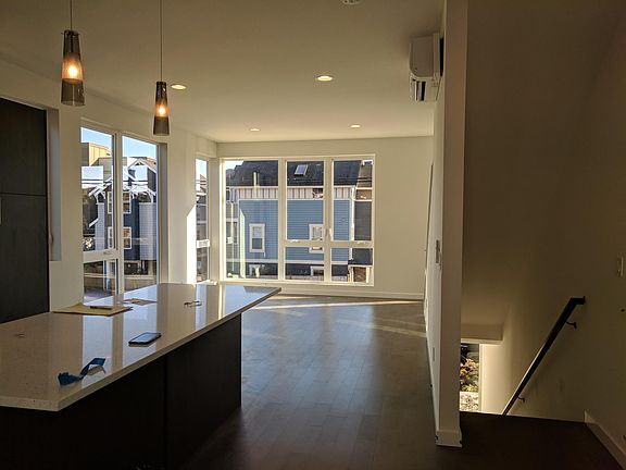 2nd-floor looking past kitchen area into the living room