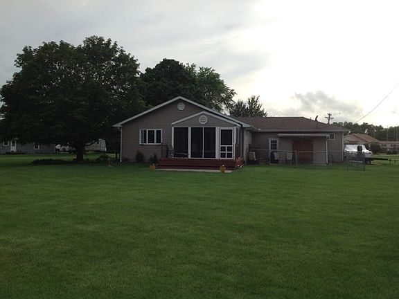 Back of house with screened-in porch