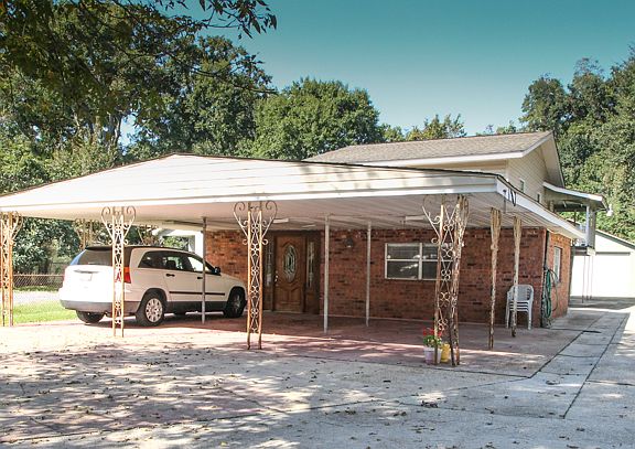 Front, three car carport