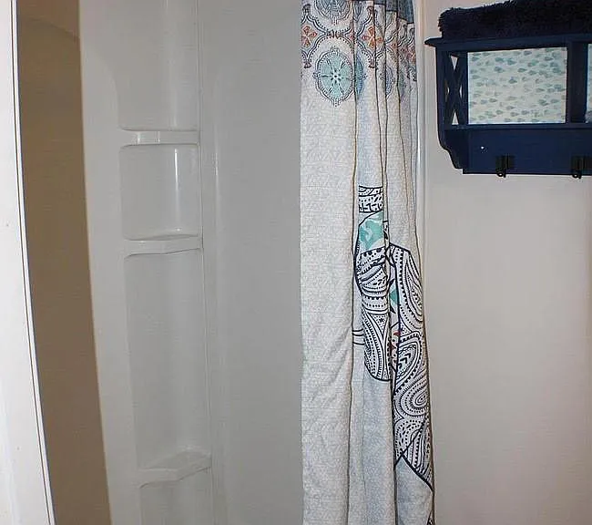 Basement bathroom with large walk in shower.
