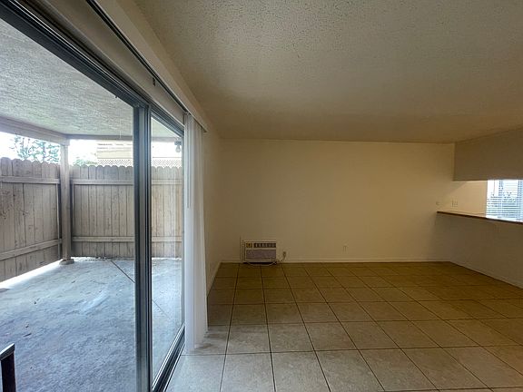 Living Room has a sliding door that leads to the enclosed patio