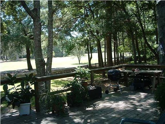 Fabulous back deck overlooking shaded, fenced-in back yard.