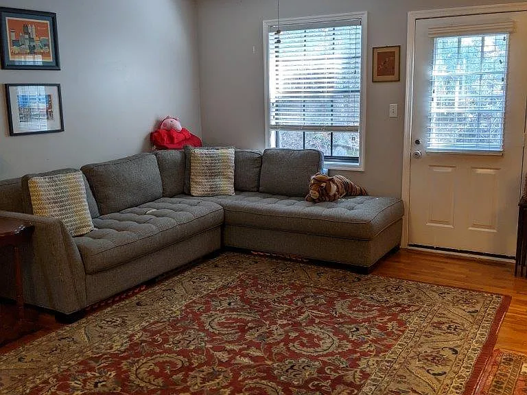 Spacious family room & flexible floor plan. FR has a ceiling fan and wood floors and a door to the private rear patio.