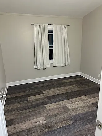 Bedroom 2 located in the center of the hallway also features in-floor radiant heat with a designated thermostat.