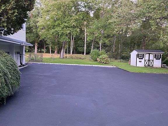 Driveway looking into backyard