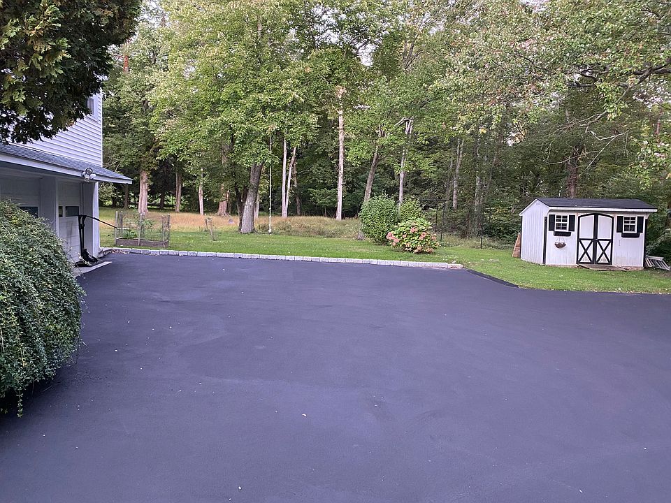 Driveway looking into backyard