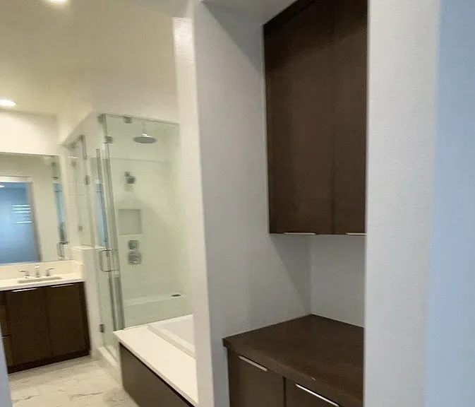 3rd floor - Primary bedroom with bathroom, large walk in closet with built in storage cabinets