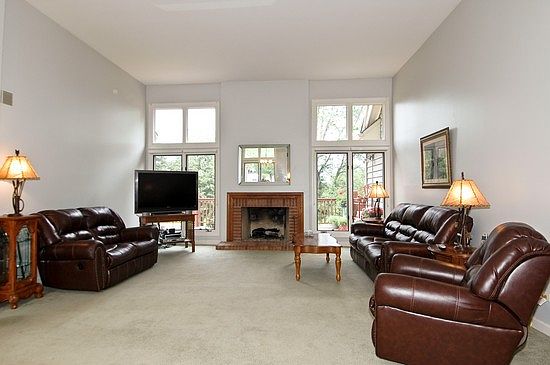 Vaulted living room with warming fireplace