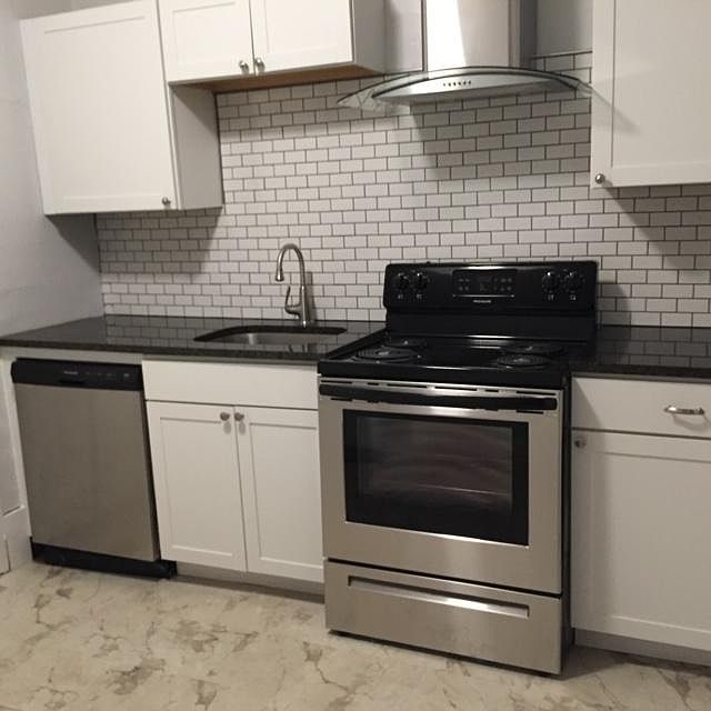 Newly renovated kitchen - granite counter tops, backsplash, cabinets, stainless steel appliances, new floor