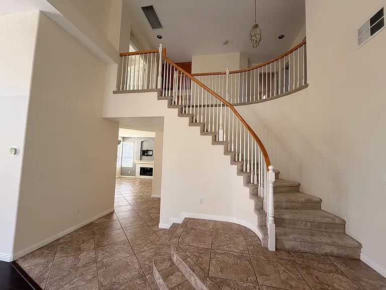 Stairs up to second floor landing.
