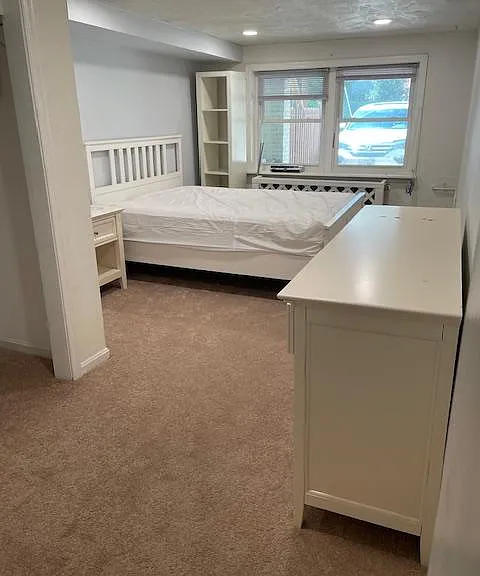 Large bedroom comes with furniture. Full-sized bed, large dresser, night stand, and tall bookcase, and tv (mounted on wall-not seen in picture). All carpets replaced 1.5 years ago.