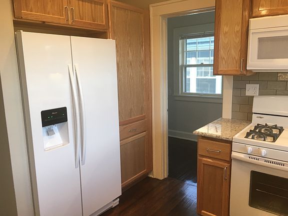 Kitchen showing new refrigerator